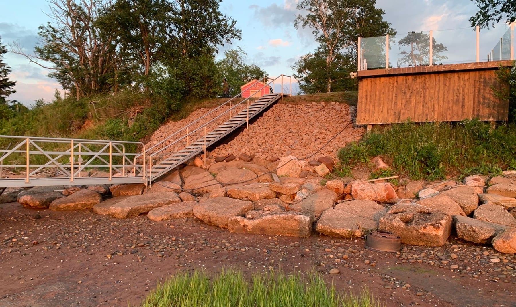 Completed stone slope stabilization beside an Island shoreline